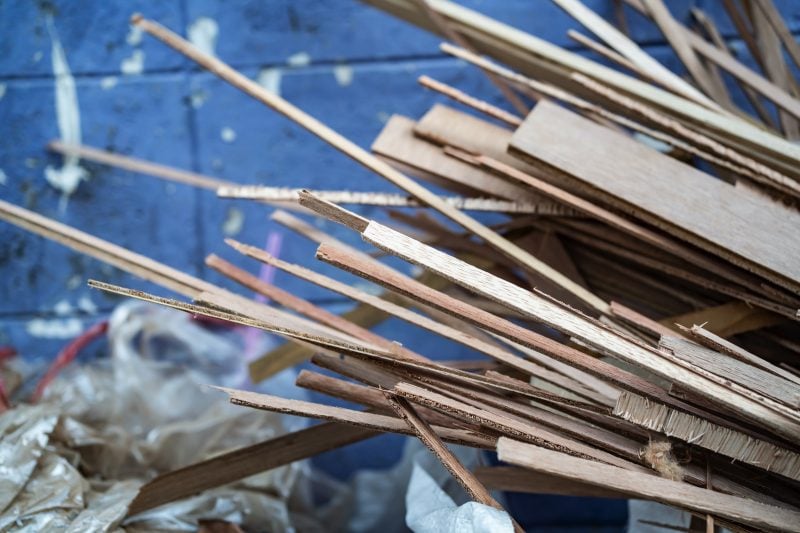 Pieces of scrap wood inside a skip